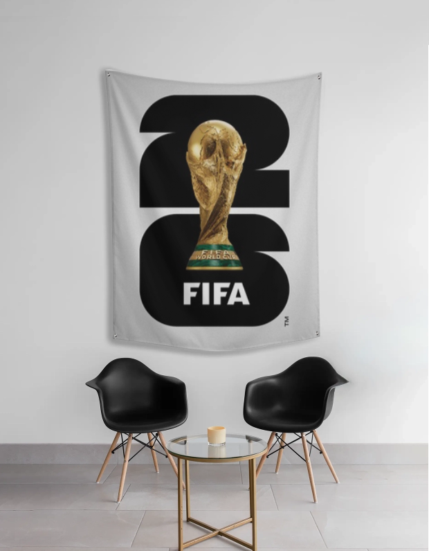FIFA World Cup 2026 tapestry hanging on a wall above two black chairs.