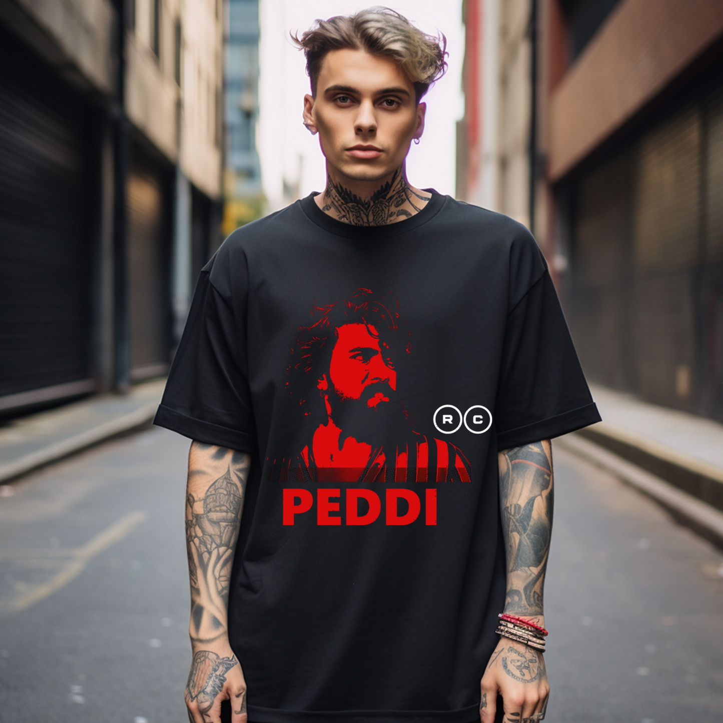 Person wearing a black t-shirt with a red graphic and text in an urban setting