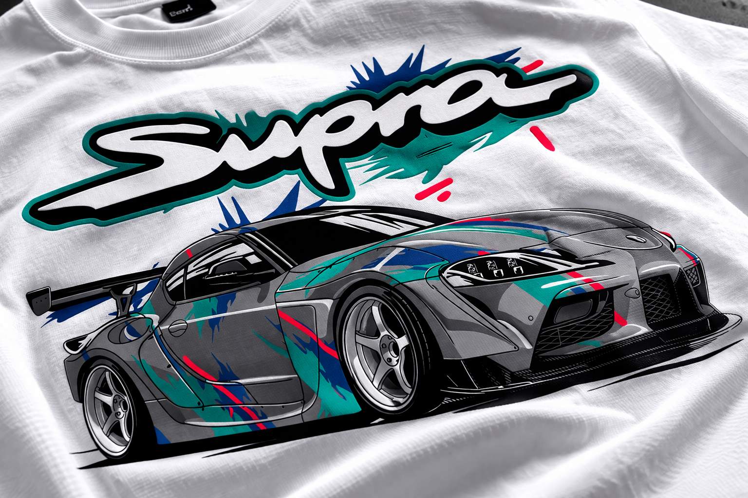 White t-shirt with a colorful car graphic and 'Supra' text on a white background