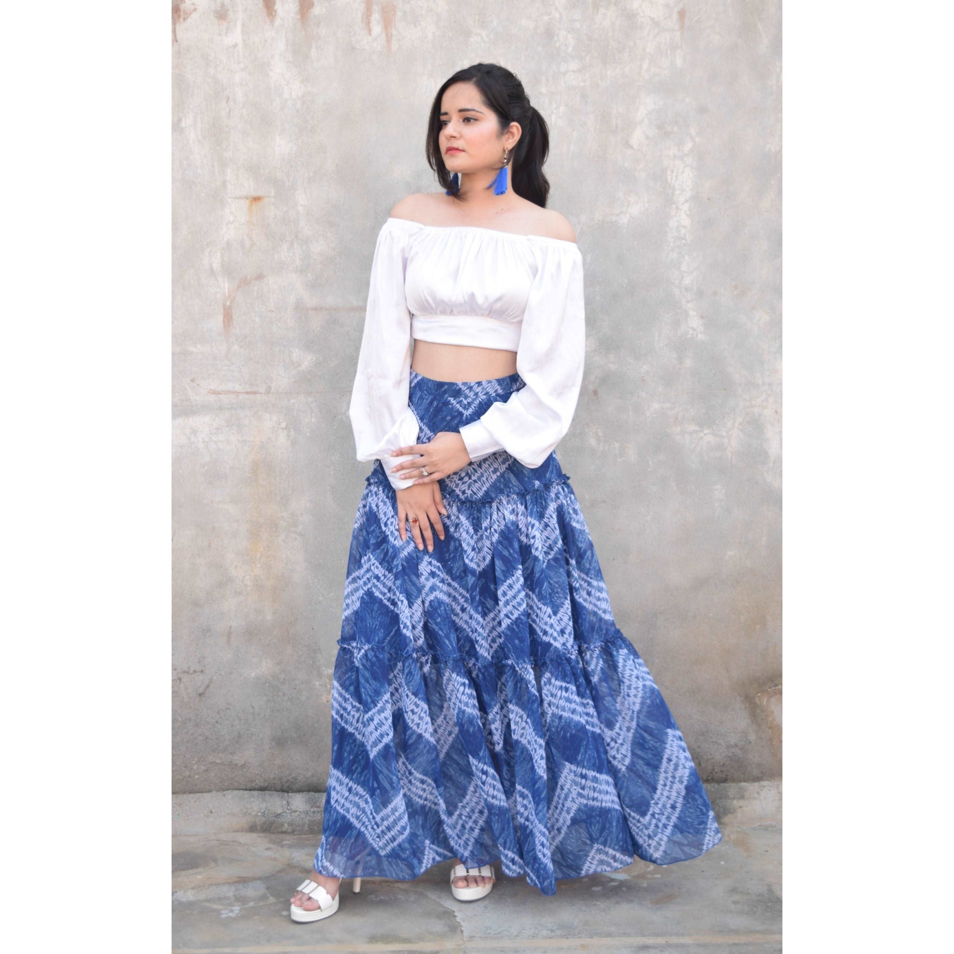 Discover the vibrant charm of our Blue Tie and Dye Printed Tiered Flared Skirt, now on sale at APEKSH. This eye-catching skirt features a unique tie and dye pattern,dye printed tiered flared skirt